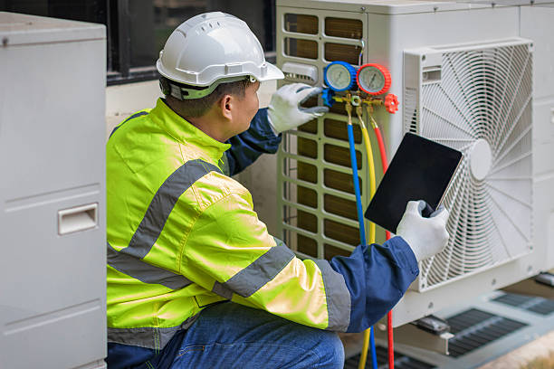 Professional Air Conditioning Repair technician working in Norton, MA